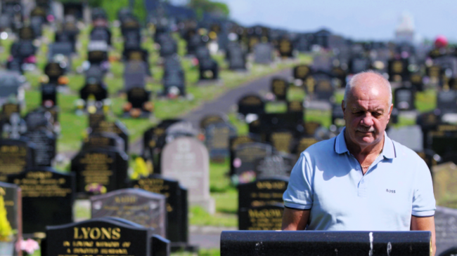 RAYMOND MCCORD at the graveside of his son, Raymond Junior, murdered by the UVF.