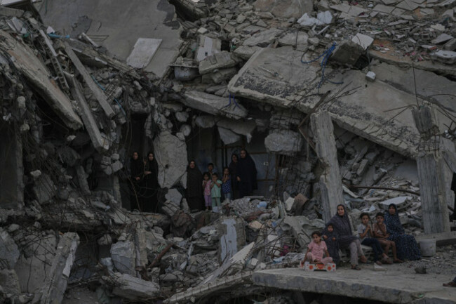 palestinian-women-and-children-watch-the-palestine-strongman-championship-from-among-the-rubble-of-destroyed-buildings-in-gaza-city-friday-oct-16-2026-ap-photojehad-alshrafi