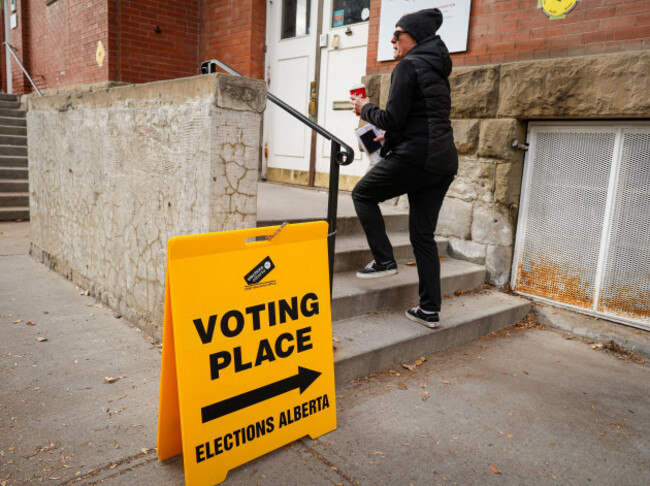 a-voter-enters-a-polling-station-to-cast-their-vote-in-the-alberta-referendum-in-calgary-alberta-canada-monday-oct-19-2026-jeff-mcintoshthe-canadian-press-via-ap