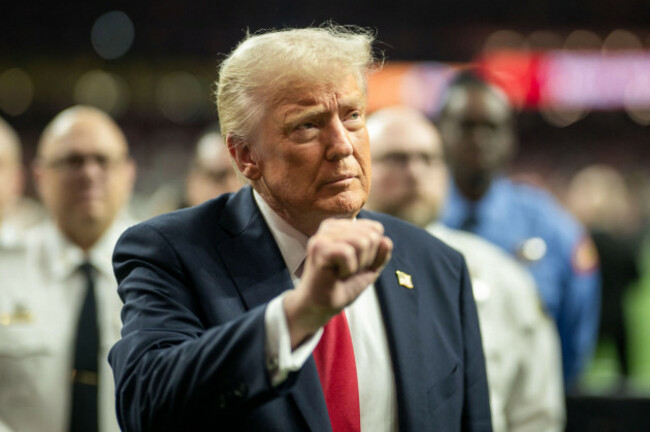 president-donald-trump-raising-a-fist-during-super-bowl-lix-at-the-caesars-superdome-in-new-orleans-louisiana-usa