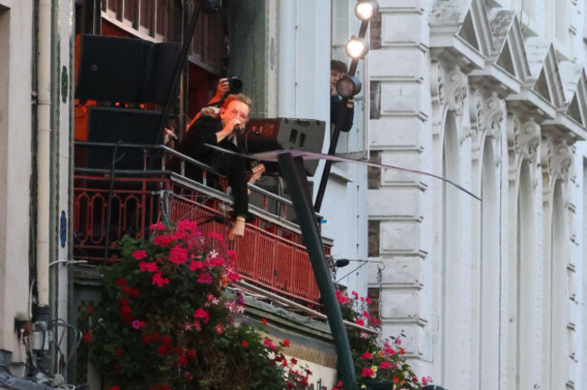 bono-looks-out-on-the-crowd-as-u2-perform-an-impromptu-concert-from-a-balcony-in-central-dublin-ireland-friday-sept-25-2026-ap-photopeter-morrison