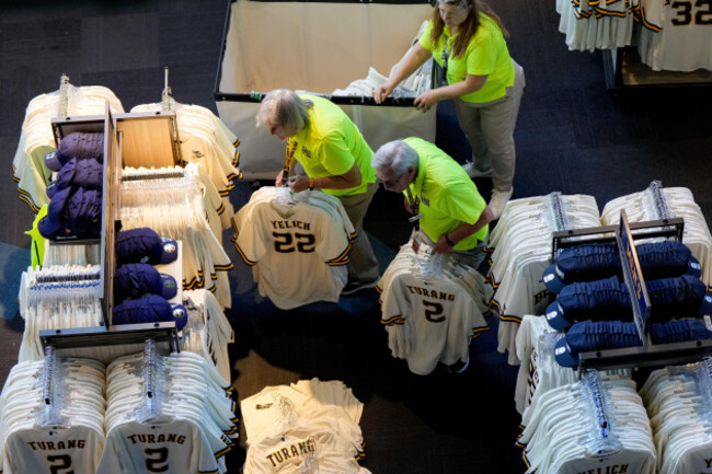 workers-stock-merchandise-in-the-team-store-during-a-world-series-baseball-media-day-thursday-oct-22-2026-in-milwaukee-ahead-of-game-1-between-the-milwaukee-brewers-and-the-tampa-bay-rays-ap-p