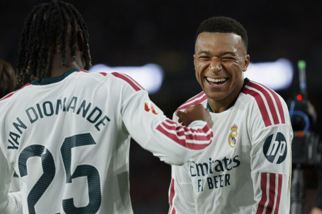 real-madrids-kylian-mbappe-right-celebrates-after-scoring-his-sides-opening-goal-during-a-spanish-la-liga-soccer-match-between-fc-barcelona-and-real-madrid-in-barcelona-spain-sunday-oct-25-20