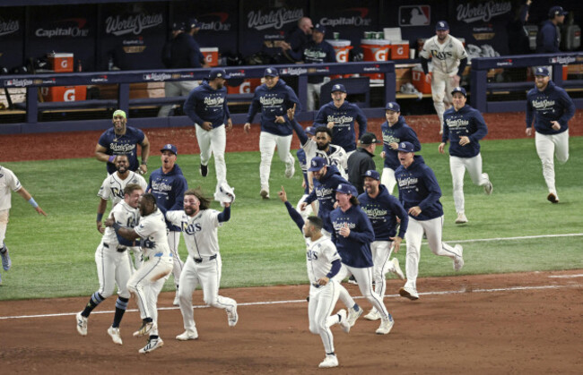 tampa-bay-rays-players-celebrate-after-pinch-hitter-ben-williamson-front-far-l-hit-a-walk-off-single-in-the-12th-inning-of-game-4-of-the-world-series-against-the-milwaukee-brewers-at-tropicana-fiel