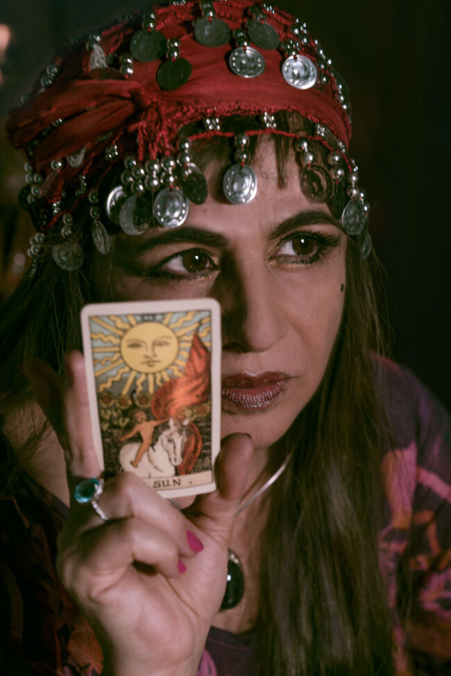 woman-fortune-teller-reading-the-tarot-wearing-a-gipsy-outfit-clairvoyance-phychic