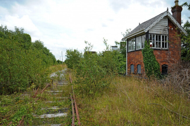 a-derelict-and-overgrown-signal-box-at-foynes-station-on-the-disused-foynes-to-limerick-railway-line-co-limerick-ireland
