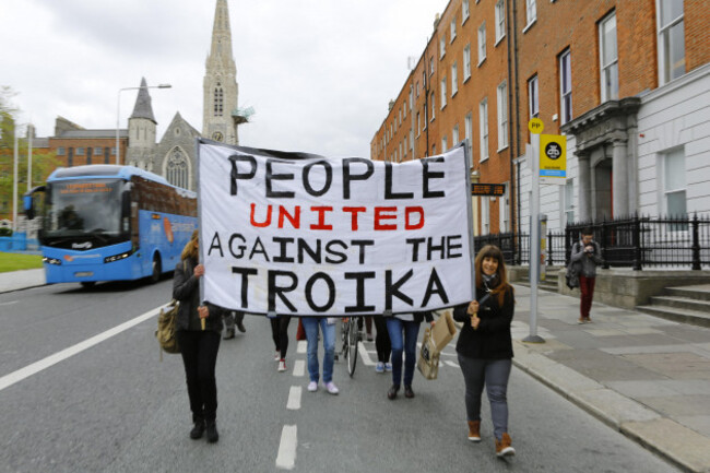dublin-ireland-1st-june-2013-protester-march-through-dublin-carrying-a-banner-that-reads-people-united-against-the-troika-protesting-against-austerity-measures-activists-assembled-in-dublin-as