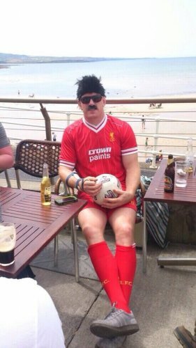 liverpool fans wearing full kit